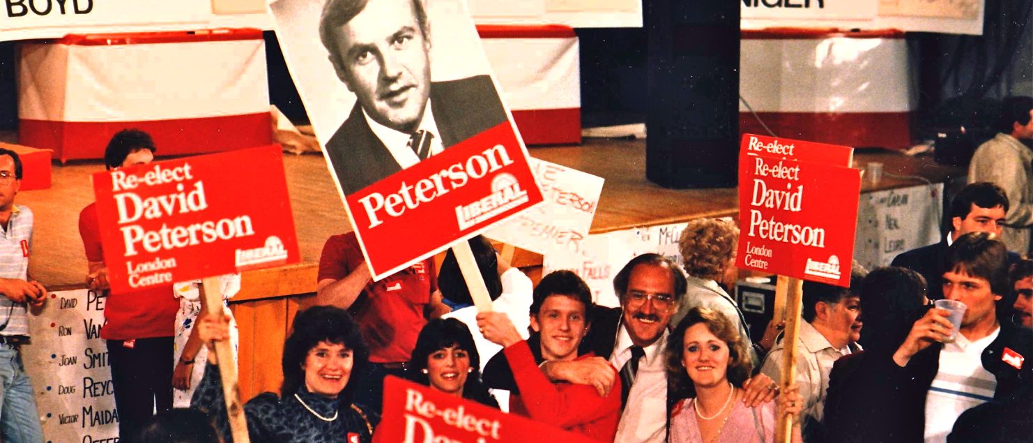 Peterson supporters with signs on election night